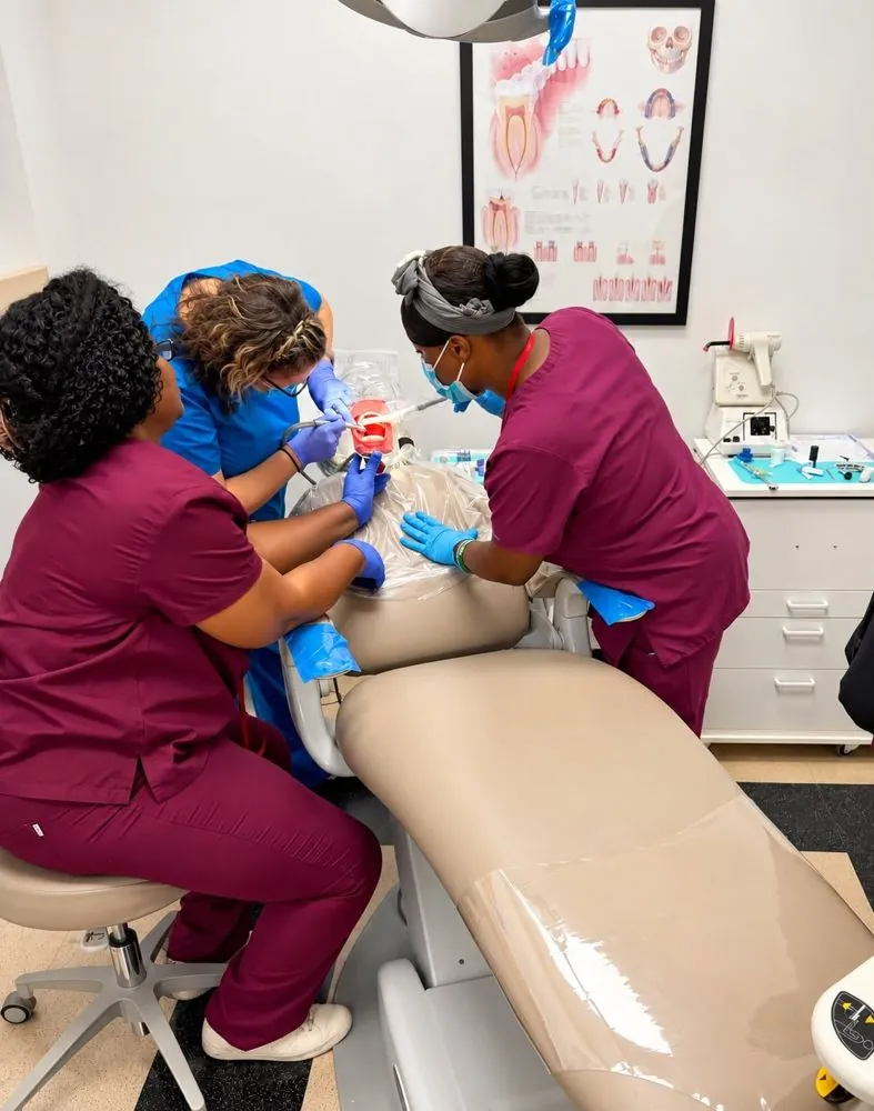 Dental assisting students working chairside